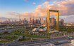Al Jafiliya_a city street with tall buildings and traffic lights