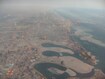 Al Mamzar_a large body of water surrounded by tall buildings