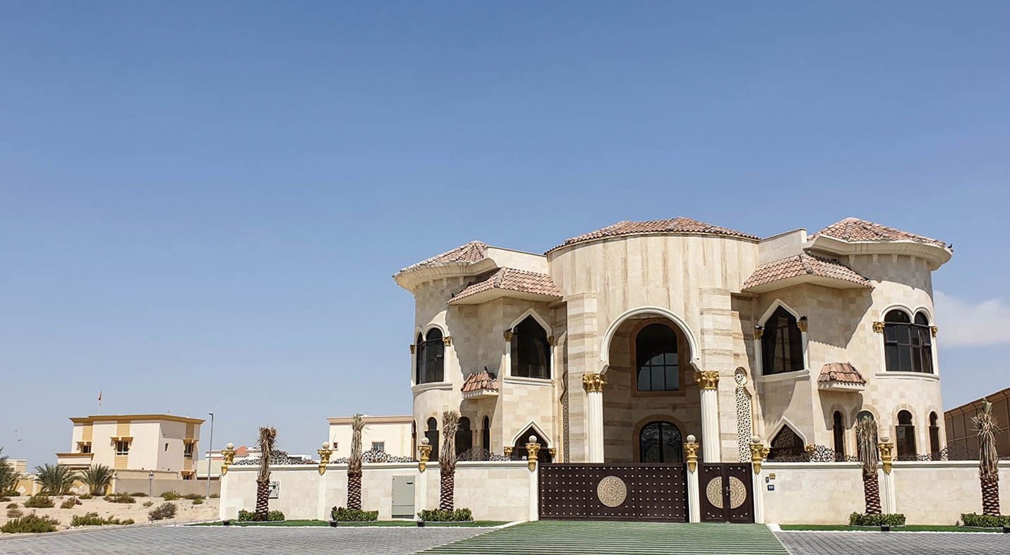Al Rashidiya_a large white building with a blue roof