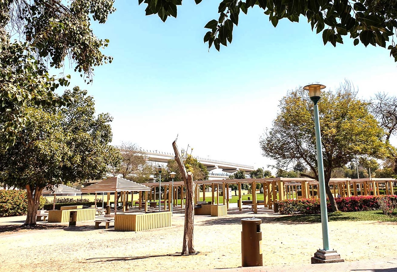 Al Rashidiya_a park with benches and a tree