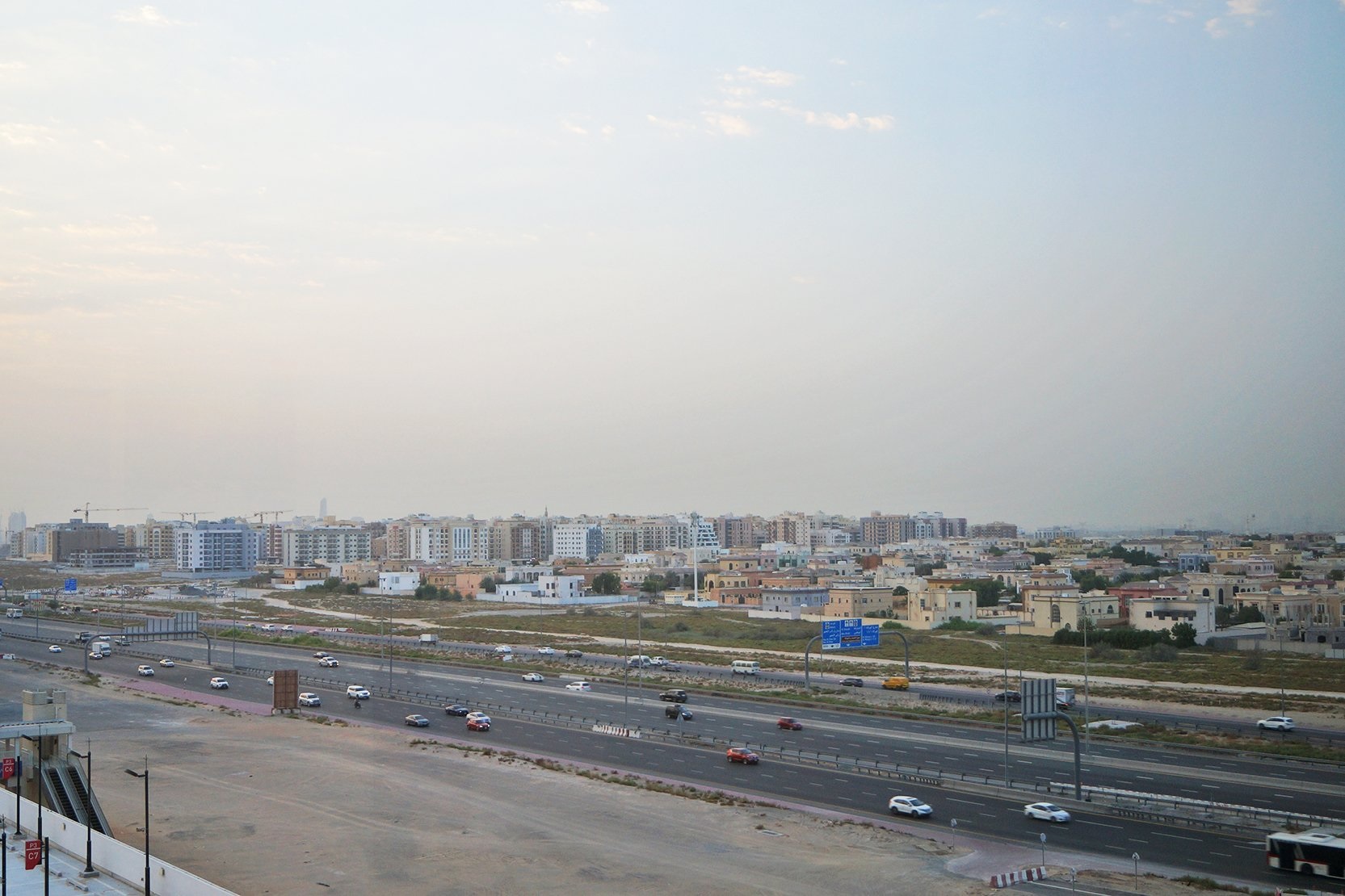 Al Warqaa_a highway filled with lots of cars and trucks