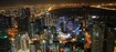 Barsha Heights (Tecom)_a city at night with many tall buildings