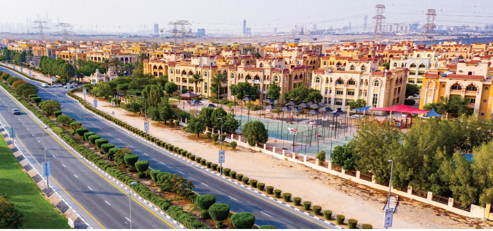 Dubai Investment Park (DIP)_a city street filled with lots of tall buildings