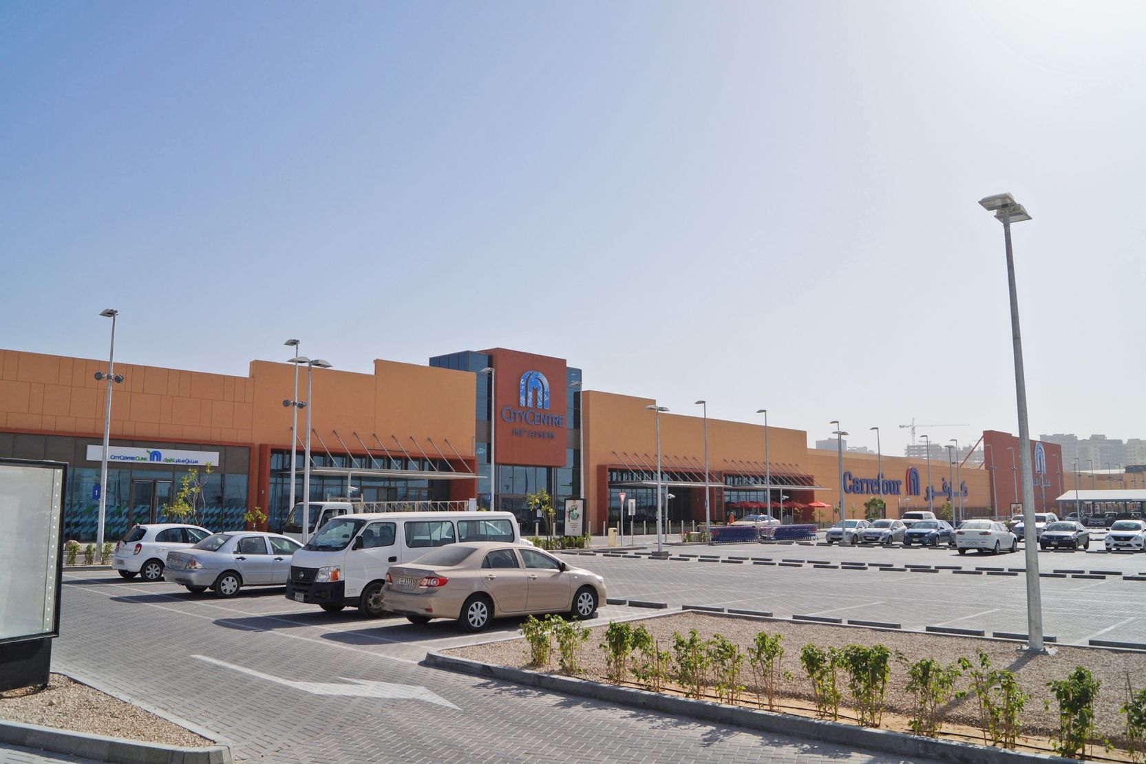 Dubai Production City (IMPZ)_a parking lot filled with lots of cars and trucks