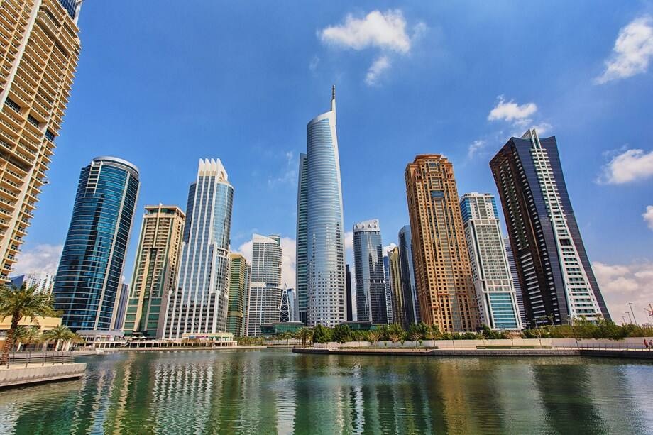 Jumeirah Lake Towers (JLT)_a city with tall buildings and a river