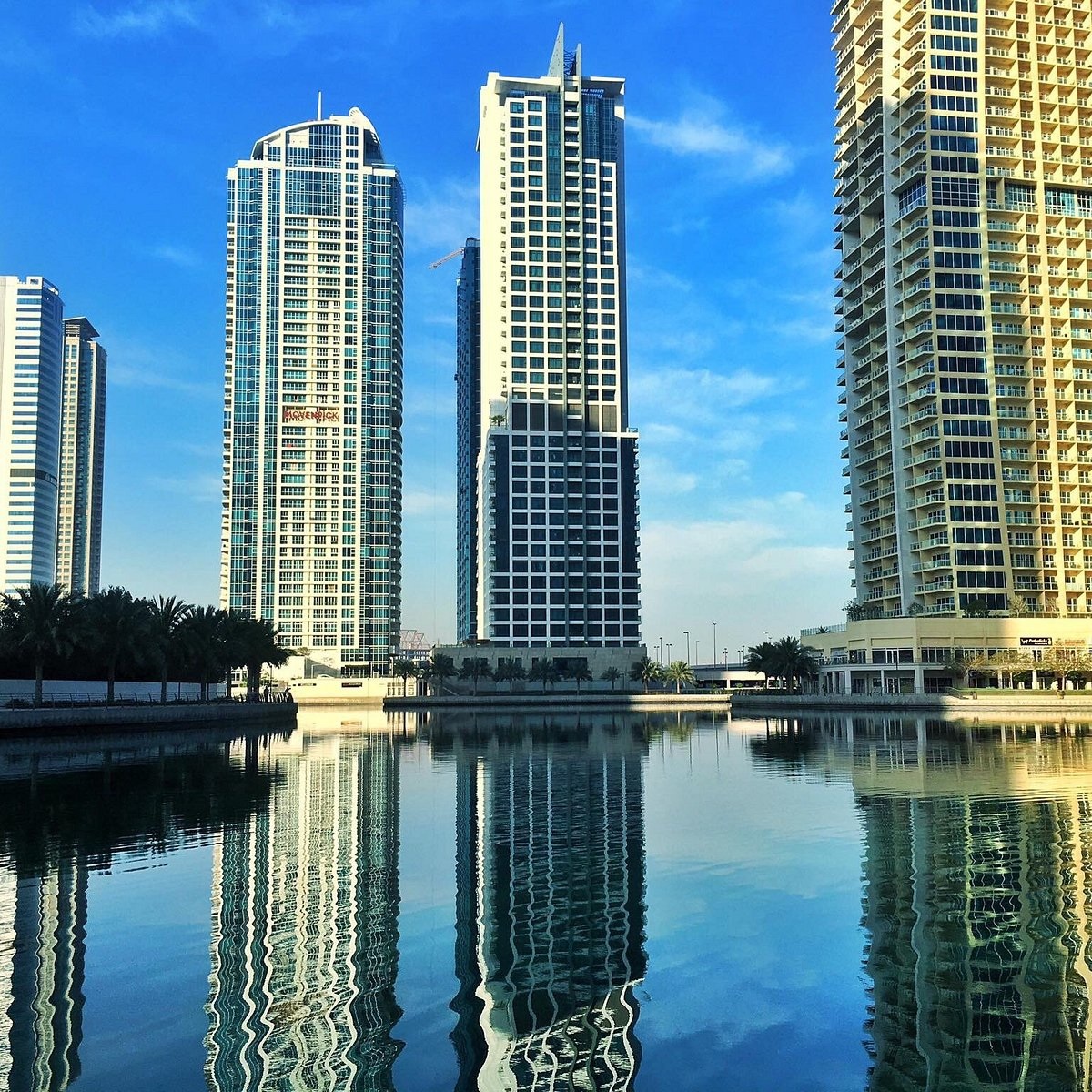 Jumeirah Lake Towers (JLT)_a city with tall buildings and a river