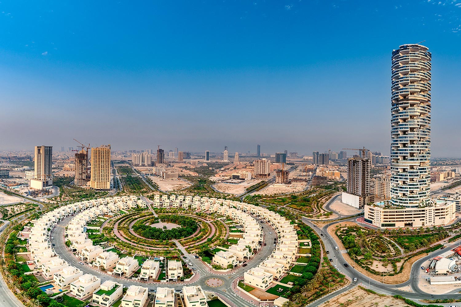 Jumeirah Village Circle (JVC)_a cityscape of a large city with tall buildings