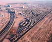 Jumeirah Village Triangle (JVT)_an aerial view of a city with many train tracks