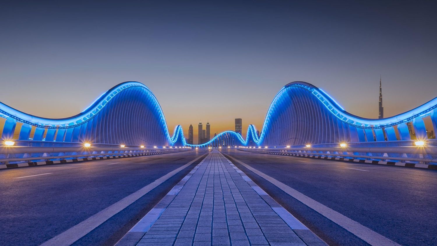 Nad Al Sheba_a city street filled with lots of traffic at night