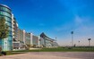 Nad Al Sheba_a large building with a large clock on the side of it